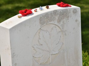 Objects placed on a grave in the Canadian First World War military cemetery in Vimy, near Arras, northern France