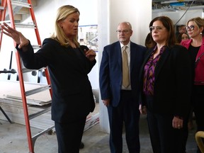 Christy Dzikowicz (left), executive director of the Toba Centre for Children and Youth, give Justice minister Kelvin Goertzen, Premier Heather Stefanson and Families minister Rochelle Squires a tour of its future home in Assiniboine Park in Winnipeg after a news conference on Sunday, March 12, 2023.