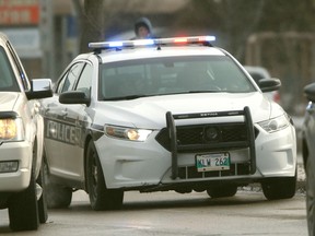 A police car in traffic in Winnipeg.