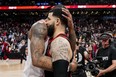 DeMar DeRozan of the Bulls hugs Fred VanVleet of the Raptors after Chicago rallied to defeat Toronto in their NBA play-in game at Scotiabank Arena on April 12, 2023.