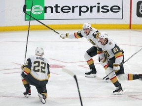 Brett Howden (21), Ivan Barbashev (49) and Michael Amadio (22) of the Vegas Golden Knights celebrate defeating the Winnipeg Jets in the second overtime period of Game 3 of the First Round of the 2023 Stanley Cup Playoffs on April 22, 2023 at Canada Life Centre in Winnipeg.