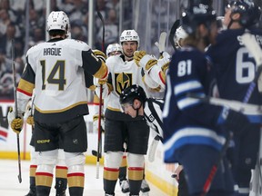 WINNIPEG, CANADA - APRIL 24: Shea Theodore #27 of the Vegas Golden Knights celebrates with teammates on the bench after a goal by teammate Ivan Barbashev #49 during action against the Winnipeg Jets in the second period of Game Four of the First Round of the 2023 Stanley Cup Playoffs on April 24, 2023 at Canada Life Centre in Winnipeg, Manitoba, Canada. (Photo by Jason Halstead/Getty Images)