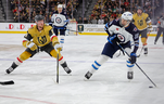 LAS VEGAS, NEVADA - APRIL 18: Morgan Barron #36 of the Winnipeg Jets skates with the puck against Jack Eichel #9 of the Vegas Golden Knights in the third period of Game One of the First Round of the 2023 Stanley Cup Playoffs at T-Mobile Arena on April 18, 2023 in Las Vegas, Nevada. The Jets defeated the Golden Knights 5-1. (Photo by Ethan Miller/Getty Images)