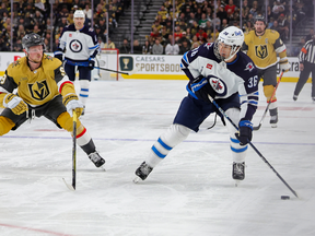 LAS VEGAS, NEVADA - APRIL 18: Morgan Barron #36 of the Winnipeg Jets skates with the puck against Jack Eichel #9 of the Vegas Golden Knights in the third period of Game One of the First Round of the 2023 Stanley Cup Playoffs at T-Mobile Arena on April 18, 2023 in Las Vegas, Nevada. The Jets defeated the Golden Knights 5-1. (Photo by Ethan Miller/Getty Images)