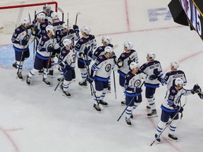 The Winnipeg Jets celebrate their 5-1 victory over the Vegas Golden Knights in Game One of the First Round of the 2023 Stanley Cup Playoffs at T-Mobile Arena.