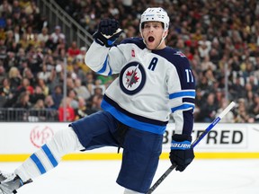 Adam Lowry of the Winnipeg Jets celebrates after scoring a goal against the Vegas Golden Knights.