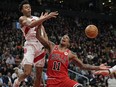 Bulls forward DeMar DeRozan (11) reacts after having a shot blocked by Toronto Raptors forward Scottie Barnes.