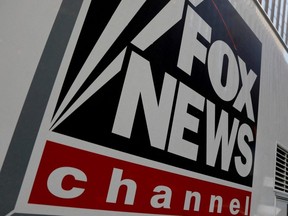 A Fox News channel sign is seen on a television vehicle outside the News Corporation building in New York City, Nov. 8, 2017.