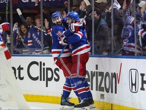 New York Rangers centre Mika Zibanejad (93) celebrates with left wing Chris Kreider (20) after scoring a goal against the New Jersey Devils during the second period in game six of the first round of the 2023 Stanley Cup Playoffs at Madison Square Garden in New York on April 29, 2023.
