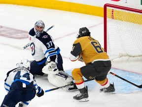 Mark Stone of the Vegas Golden Knights scores against Winnipeg Jets goalie Connor Hellebuyck during Game 2 of the Stanley Cup playoff series in Las Vegas.