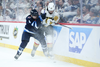 Winnipeg Jets defenceman Neal Pionk checks Vegas Golden Knights forward Chandler Stephenson (20) during the first period in game four of the first round of the 2023 Stanley Cup Playoffs at Canada Life Centre.