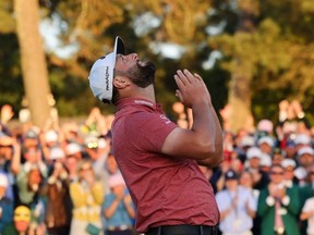 Spain's Jon Rahm celebrates on the 18th green after winning The Masters at Augusta National Golf Club in Augusta, Ga., Sunday, April 9, 2023.