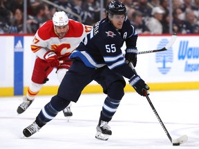 Mark Scheifele #55 of the Winnipeg Jets moves the puck past Milan Lucic #17 of the Calgary Flames. The Jets need Scheifele to be at his best to get past Vegas.