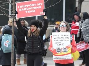 PSAC strikers are seen on Elgin St in Ottawa, April 21, 2023.