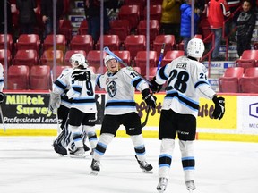 Members of the Winnipeg Ice celebrate their overtime win over the Moose Jaw Warriors on Wednesday.