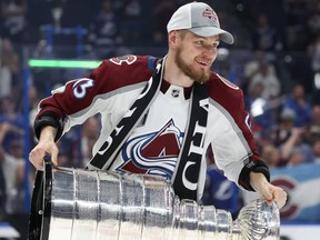 Valeri Nichushkin of the Colorado Avalanche lifts the Stanley Cup after defeating the Tampa Bay Lightning 2-1 in Game Six of the 2022 NHL Stanley Cup Final at Amalie Arena on June 26, 2022 in Tampa, Fla.