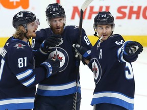 The Jets' reformed line of (from left) Kyle Connor, Pierre-Luc Dubois and Mark Scheifele is clicking at just the right time.