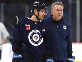 Jets coach Rick Bowness (right) said he wasn't going to take any risks by putting Nikolaj Ehlers in the line-up on Tuesday night. The Jets won 5-1 over the Vegas Golden Knights even without Ehlers.