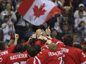Canadian players celebrate their victory over the U.S. at the men's under-18 world hockey championship in Sochi, Russia, on April 28, 2013.