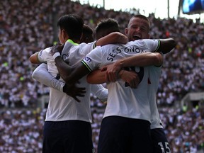 Tottenham Hotspur's English midfielder Ryan Sessegnon (C) celebrates with teammates after scoring their first goal during the English Premier League football match between Tottenham Hotspur and Southampton at Tottenham Hotspur Stadium in London, on August 6, 2022.