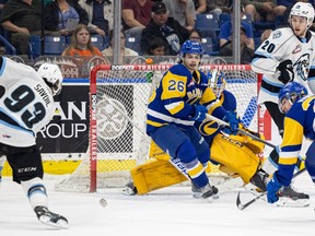 Winnipeg's Matthew Savoie fires on goal as Saskatoon Blades Spencer Shugrue (26) and goalie Ethan Chadwick defend during Game 3 of the best-of-seven Eastern Conference final against Winnipeg Ice at SaskTel Centre in Saskatoon on Tuesday, May 2, 2023. Savoie had a goal and two assists in Winnipeg's 5-1 victory to take a commanding 3-0 lead.