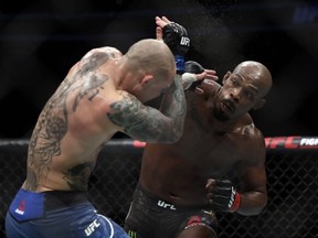 Jon Jones (R) and Anthony Smith trade punches during their light heavyweight title bout during UFC 235 at T-Mobile Arena on March 02, 2019 in Las Vegas, Nevada.