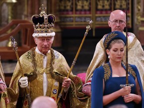 King Charles III stands after being crowned during his coronation ceremony in Westminster Abbey, on May 6, 2023 in London, England. The Coronation of Charles III and his wife, Camilla, as King and Queen of the United Kingdom of Great Britain and Northern Ireland, and the other Commonwealth realms takes place at Westminster Abbey Saturday. Charles acceded to the throne on Sept. 8, 2022, upon the death of his mother, Elizabeth II.