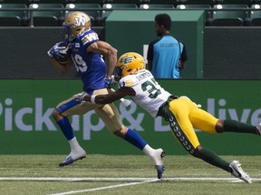 Kenny Lawler, signed as a free agent by the Winnipeg Blue Bombers in February, runs away from Dwayne Thompson of the Edmonton Elks to score a 67-yard touchdown during a CFL pre-season game on Saturday in Edmonton.