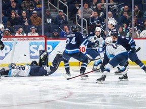 Jansen Harkins watches a shot go into the Milwaukee Admirals net for the overtime winner in Game 2 on Sunday.