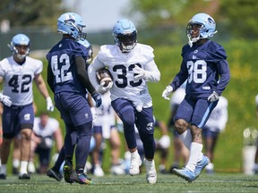 Tailback Andrew Harris runs with the ball during the first day of Toronto Argonauts training camp at Alumni Stadium at the University of Guelph on Sunday, May 14, 2023.