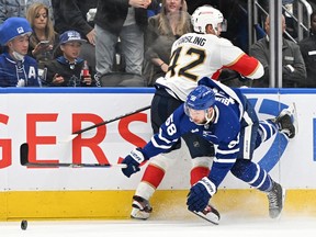 Toronto Maple Leafs forward Michael Bunting (58) collides with Florida Panthers defenceman Gustav Forsling (42) at Scotiabank Arena.