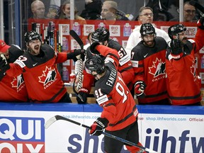Canada's Adam Fantilli celebrates scoring their third goal with teammates during the semifinal game against Latvia at the IIHF World Ice Hockey Championship at Nokia Arena in Tampere, Finland, on May 27, 2023.