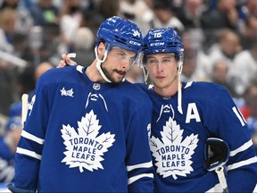 Maple Leafs forward Mitch Marner (16) speaks to forward Auston Matthews (34) before a faceoff against the Florida Panthers on Friday.