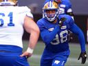 Defensive lineman Anthony Bennett (right) takes on offensive lineman Brandon Sanford during line battles at Winnipeg Blue Bombers training camp on May 16, 2023. 
