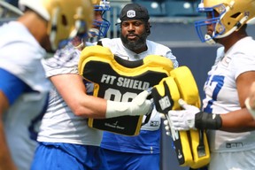 Bombers offensive lineman Stanley Bryant keeps a close eye on some of the other players during training camp on Monday at IG Field.