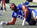 Defensive end Jackson Jeffcoat does some stretching at the Winnipeg Blue Bombers training camp on Wednesday, May 17, 2023. 