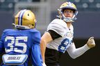 Receiver Drew Wolitarsky eyes a pass while covered by Demerio Houston at Winnipeg Blue Bombers training camp on Tuesday at IG Field.