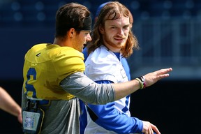 Receiver Jeremy Murphy takes some direction from Winnipeg Blue Bombers No. 2 quarterback Dru Brown during training camp on Wednesday.