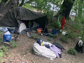 An encampment set up along the banks of the Red River near The Forks