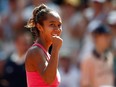 Canada's Leylah Fernandez celebrates winning her first round match against Poland's Magda Linette on May 28, 2023