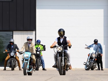 Ride leader Marc Perreault (centre) marshals those taking part in the Winnipeg version of the Distinguished Gentlemen's Ride at motorcycle shop Moto 49 in St. Boniface before they travelled to Torque Brewing on King Edward Street in support of menÕs health charity Movember on Sunday, May 21, 2023.