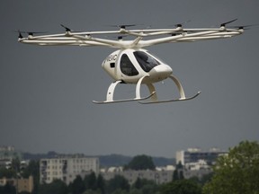 The Volocopter 2X, an electric vertical takeoff and landing multicopter, performs a demonstration flight during the Paris Air Show on June 19.