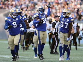 Winnipeg Blue Bombers defensive back Demerio Houston poses after intercepting a pass in the first quarter of Friday's win by the Winnipeg Blue Bombers over the Hamilton Tiger-Cats.