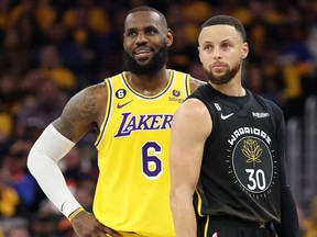 LeBron James #6 of the Los Angeles Lakers stands next to Stephen Curry #30 of the Golden State Warriors during the second quarter in game one of the Western Conference Semifinal Playoffs at Chase Center on May 02, 2023 in San Francisco, California. (Photo by Ezra Shaw/Getty Images)
