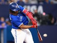 Vladimir Guerrero Jr. of the Blue Jays hits a two-run home run in the sixth inning against the Athletics at Rogers Centre in Toronto, Saturday, June 24, 2023.