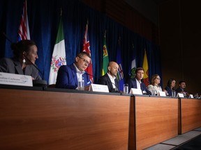 British Columbia Premier David Eby, fourth left, speaks as other premiers listen during a news conference after a meeting of western premiers, in Whistler, B.C., on Tuesday, June 27, 2023. Pictured from left to right are; Northwest Territories Premier Caroline Cochrane, Saskatchewan Premier Scott Moe, Yukon Premier Ranj Pillai, Eby, Manitoba Premier Heather Stefanson, Alberta Premier Danielle Smith and Nunavut Premier P.J. Akeeagok.