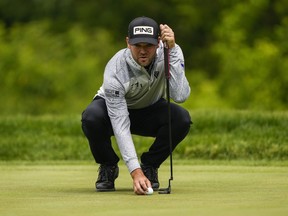 Canadian Corey Conners lines up his ball before putting on the ninth hole during the first round of the Canadian Open in Toronto on Thursday, June 8, 2023. Conners, of Listowel, Ont., is tied for second after the second round.