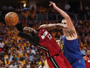Bam Adebayo of the Miami Heat battles Nikola Jokic of the Denver Nuggets during Game 1 of the NBA Finals at Ball Arena on June 1, 2023 in Denver.