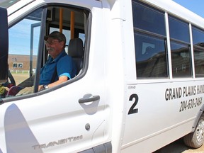 Doug Westhouse sits behind the wheel of a 12-passenger bus in Grandview, Man. on June 20, 2023. The coordinator and driver for Grand Plains Handivan transports people from Grandview and Gilbert Plains about 50 kilometres east to Dauphin for appointments, shopping and visits with family.