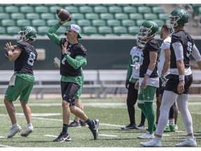 Saskatchewan Roughriders quarterbacks Mason Fine (8) and Trevor Harris (7) throw the ball during practice at Mosaic Stadium on Tuesday, June 13.